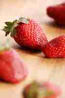 Free photo strawberries on wooden surface