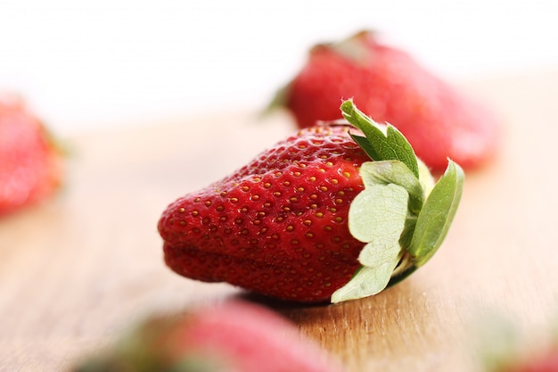 Strawberries on wooden surface