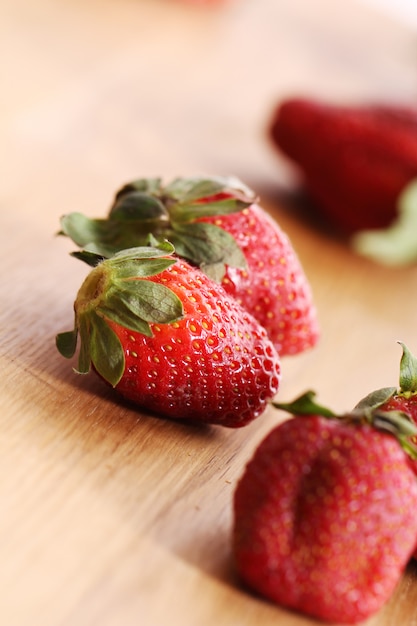 Strawberries on wooden surface