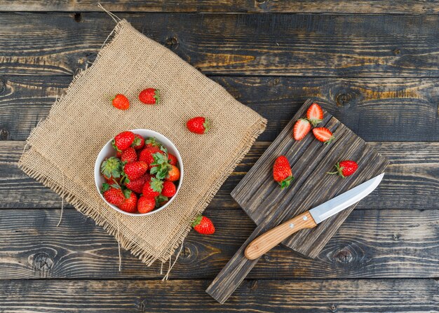 Strawberry in bowl with knife