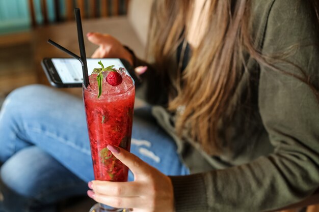 Strawberry cocktail mint syrop ice sparkling water side view