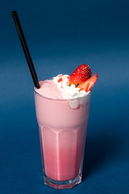 Strawberry cocktail with cream on the table