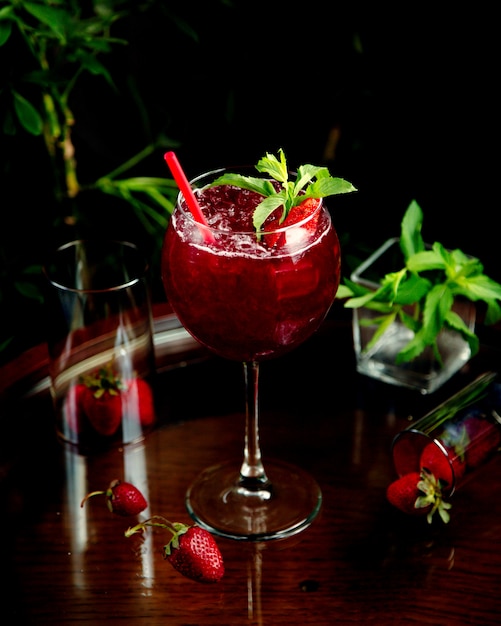 Strawberry cocktail with ice on the table