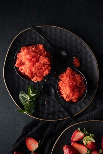 Strawberry granita dessert with mint flat lay