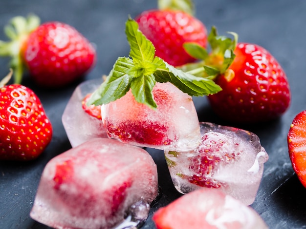Strawberry in ice cubes