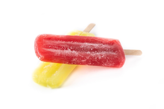 Strawberry and lemon popsicles isolated on white background