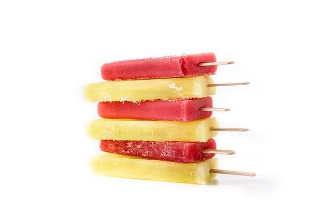 Strawberry and lemon popsicles isolated on white background
