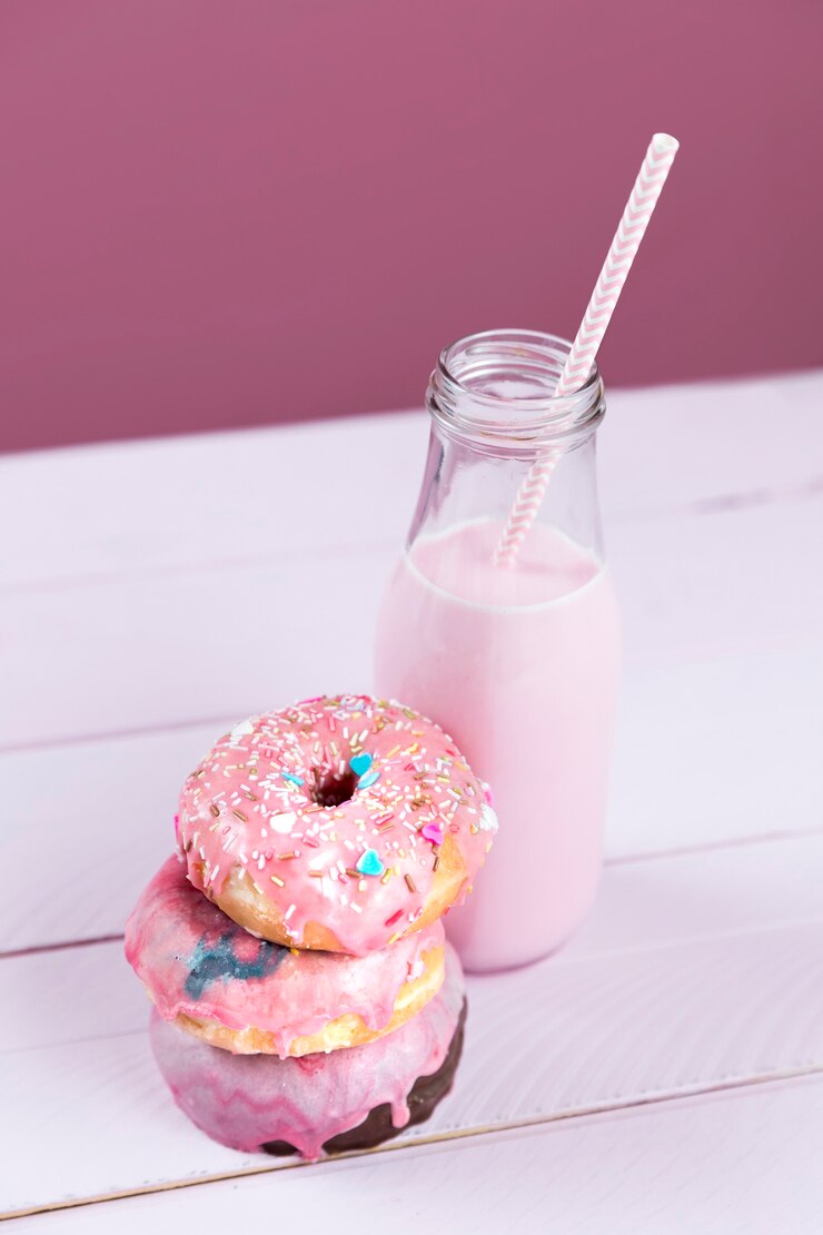 Free Photo strawberry milkshake and donuts