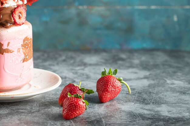 Strawberry milky shake in a glass jar