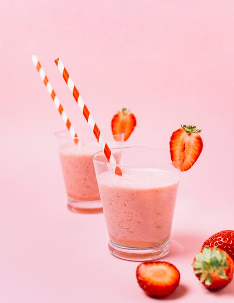 Strawberry smoothies with pink background