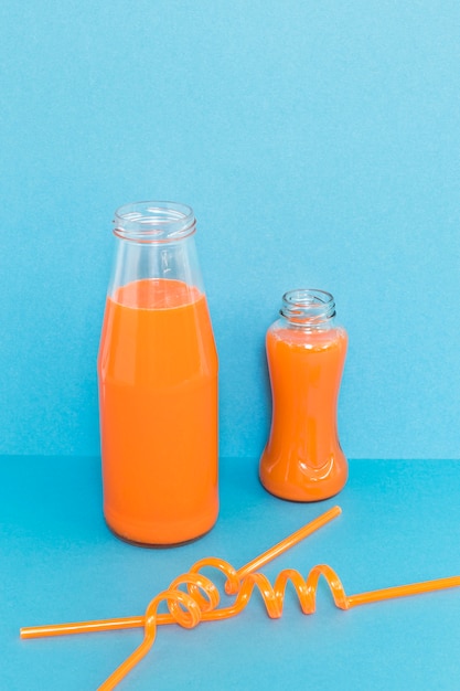 Straws and bottle with smoothie