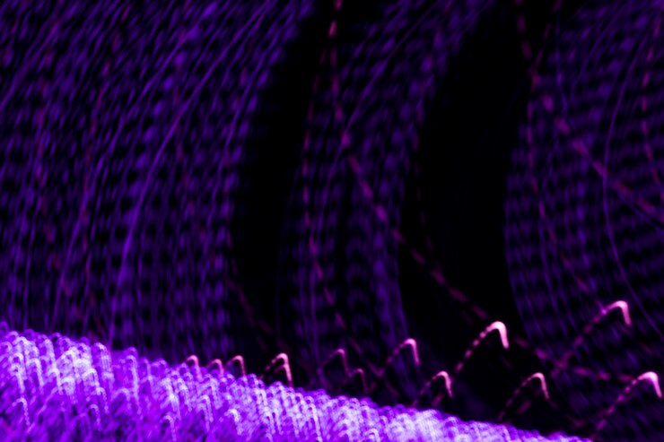 Free Photo streaky light patterns on black surface backdrop