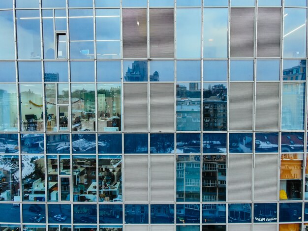 Street reflection on glass steel building facade