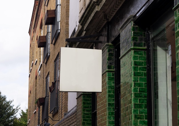 Street sign for retail store with classic green tile wall