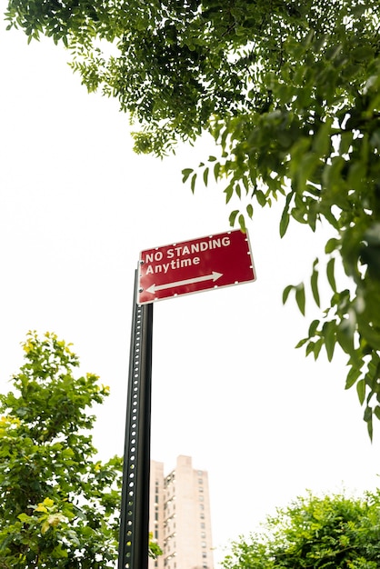 Street sign with blurred city background