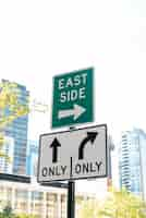 Free photo street signs with blurred city background