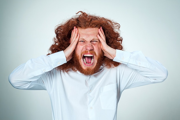 Free photo stressed businessman with a headache