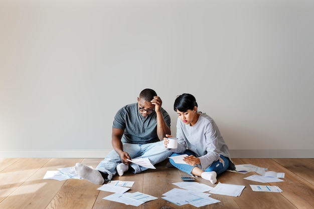 Stressed couple figuring out their finances