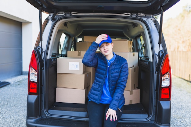 Free photo stressed girl having problem with delivering order