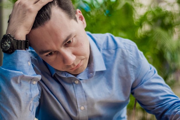 Free photo stressed man. emotion portrait, alone man. indoor portrait. businessman in depression with hands on forehead