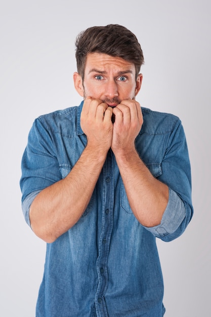 Free photo stressed man wearing a denim shirt