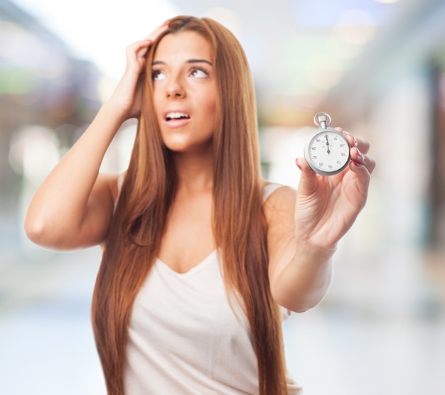 Stressed woman with stopwatch
