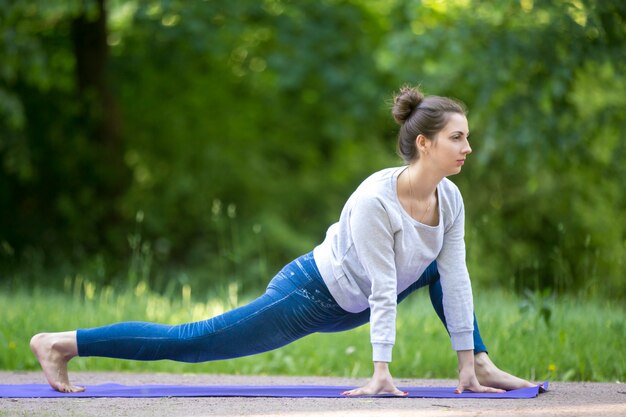 Stretching exercises in park alley