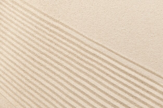 Free Photo striped zen sand background in wellness concept