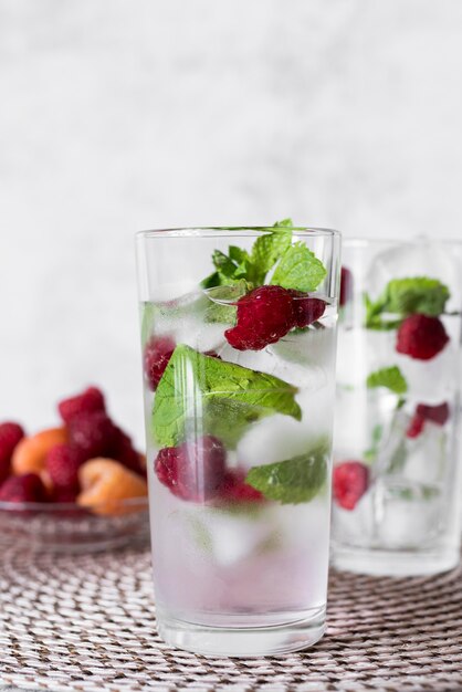 Strong alcoholic beverage with raspberry and mint