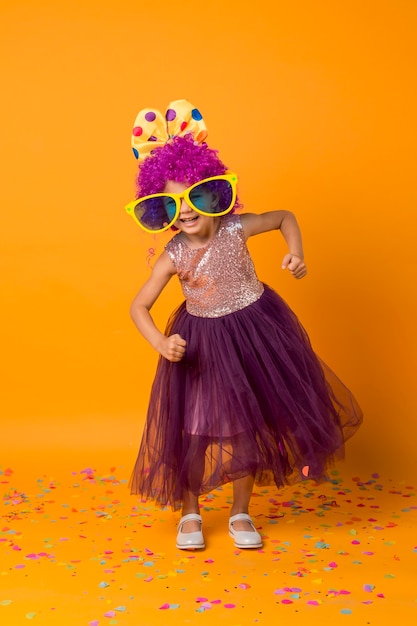 Free photo strong girl with clown wig and tutu