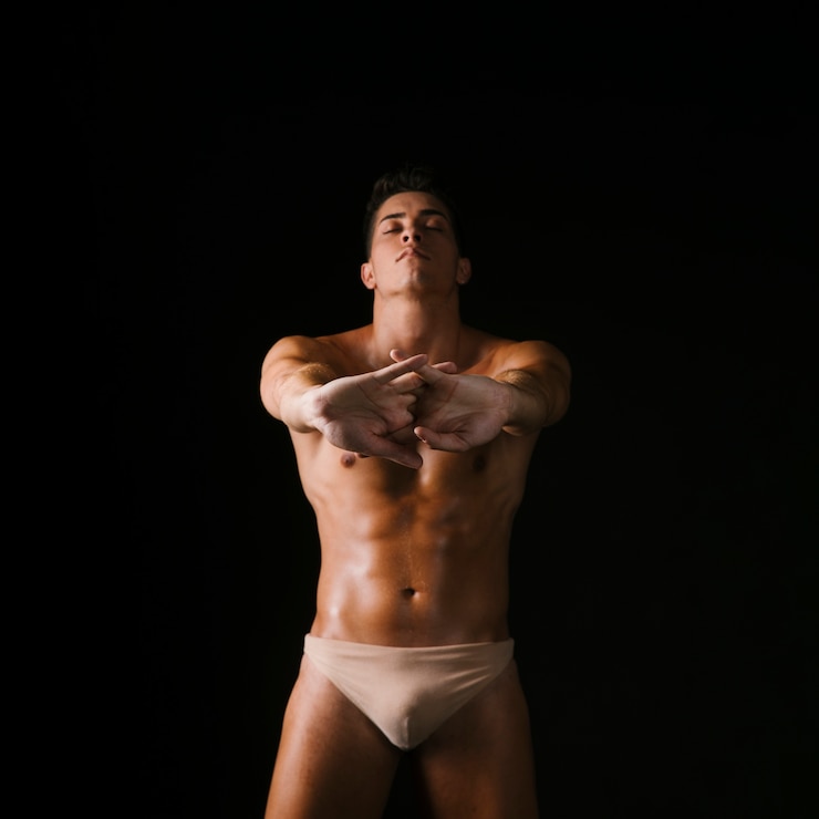 Free Photo strong guy stretching arms