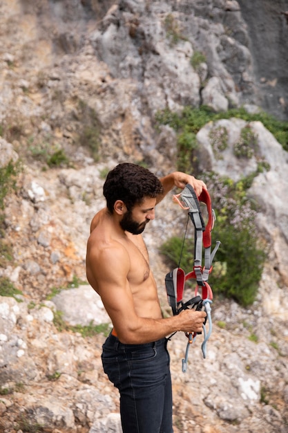 Strong man getting ready to climb