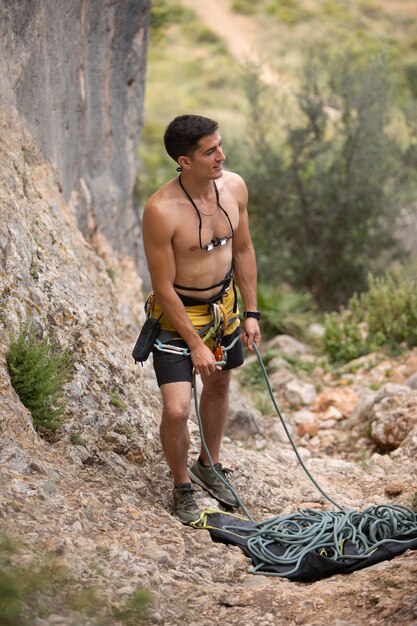 Strong man getting ready to climb