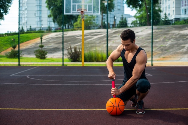 Strong man inflating a ball long shot