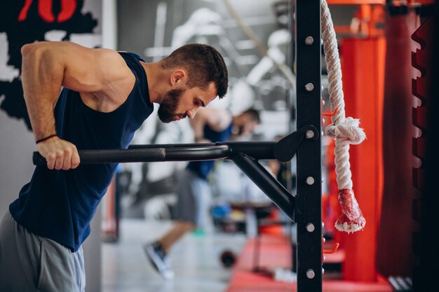 Strong man training in gym