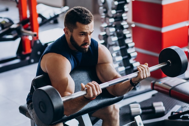 Strong man training in gym