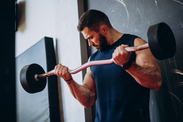 Strong man training in gym