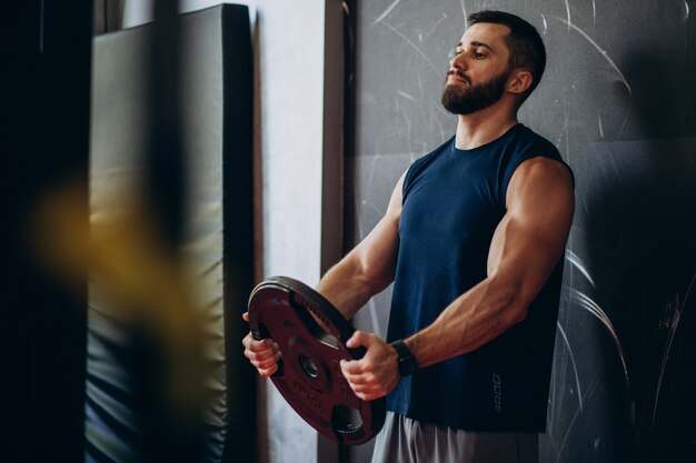 Strong man training in gym