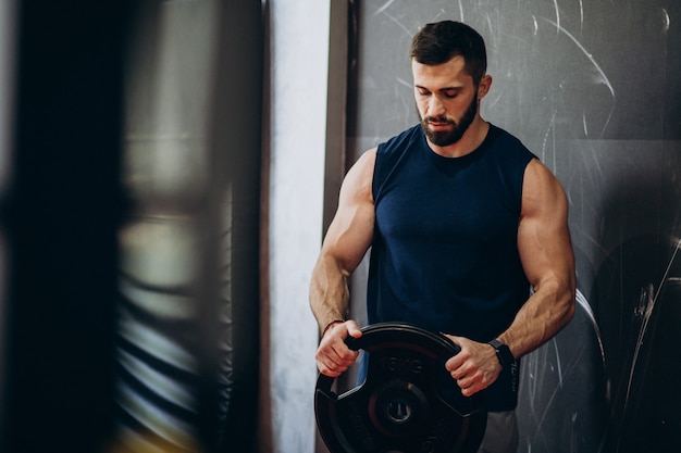 Strong man training in gym