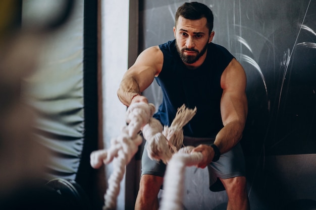 Strong man training in gym