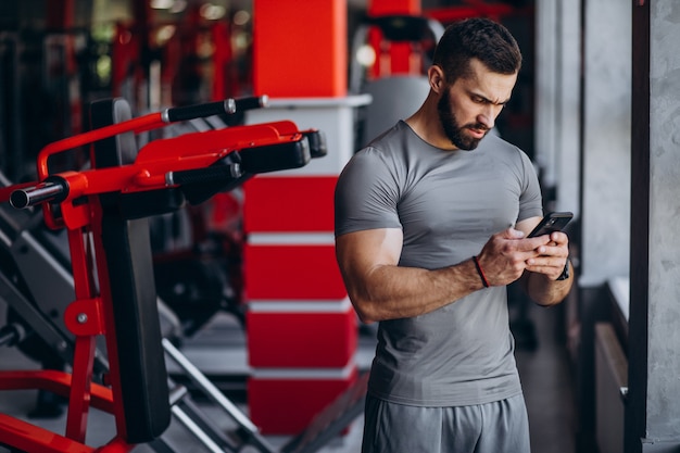 Strong man training in gym