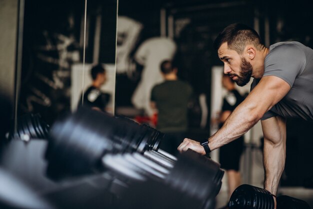 Strong man training in gym