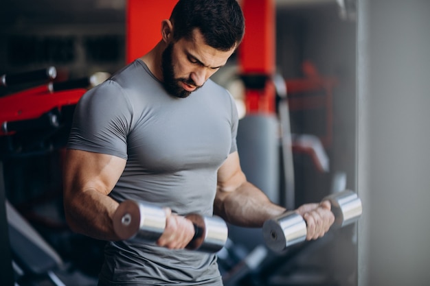 Strong man training in gym