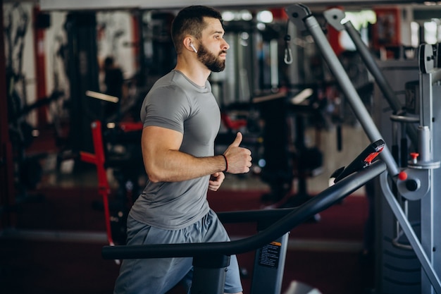 Strong man training in gym