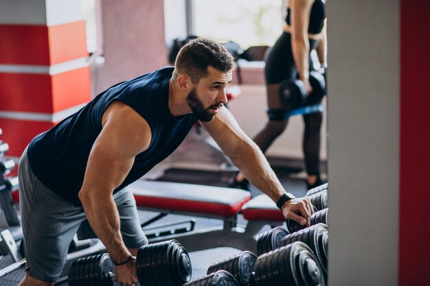 Strong man training in gym