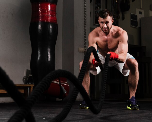 Strong man training hard for boxing competition