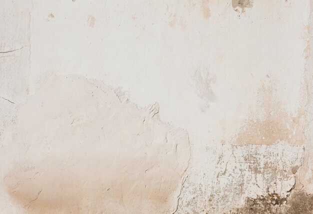 Stucco damaged wall with stains