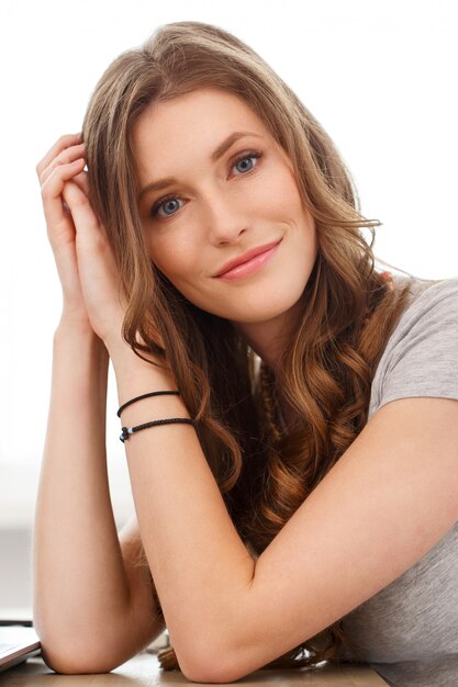 Student. Attractive girl by the table