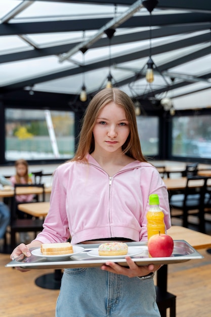 Student having lunch in the canteen