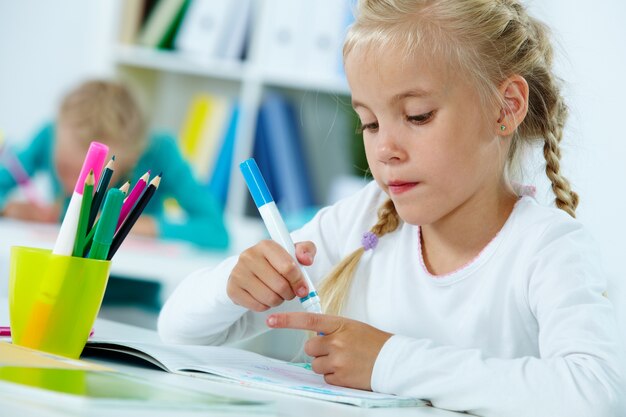 Student holding a highlighter